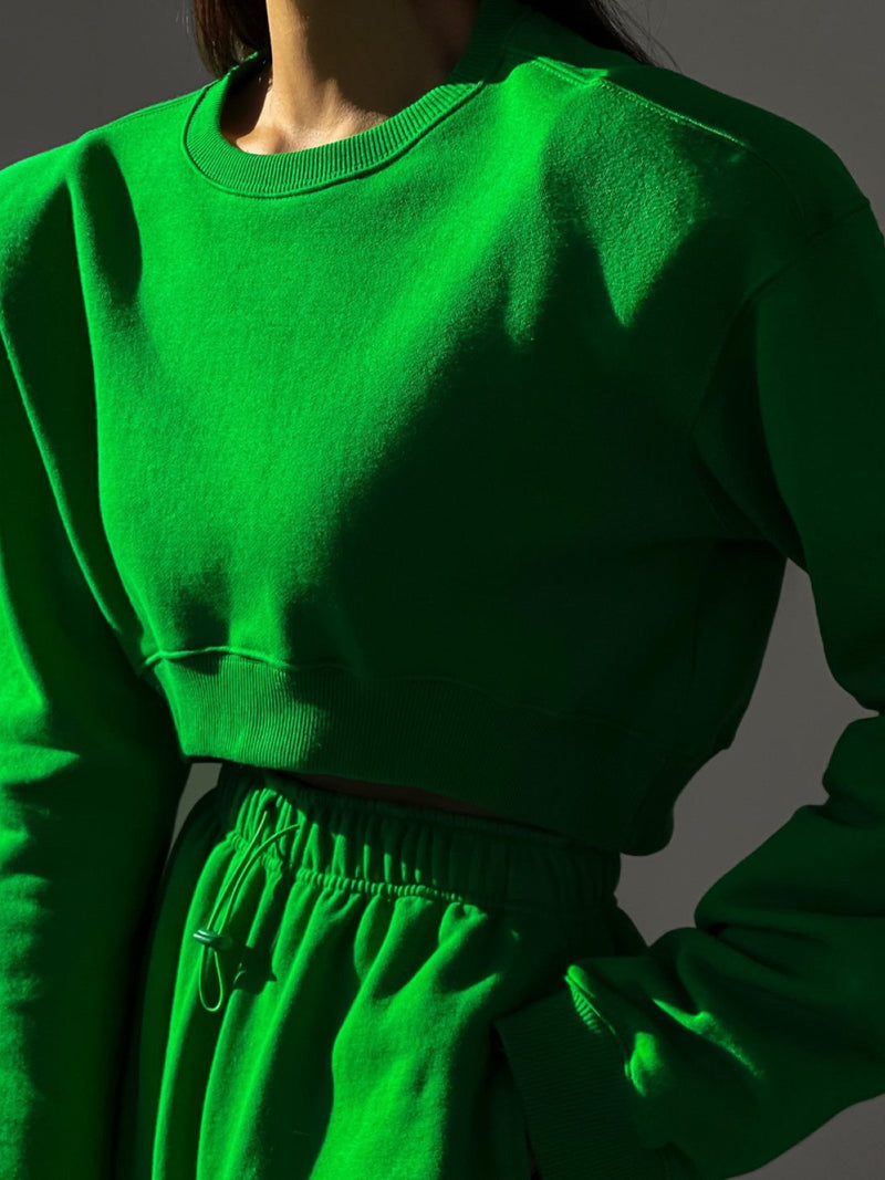 PADDED SHOULDER UNBALANCED CROPPED SWEATSHIRT